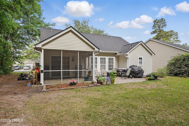 29 Wiregrass Way, Bluffton, SC 29910 - rear view of house with a patio, a sunroom, a lawn, and roof with shingles