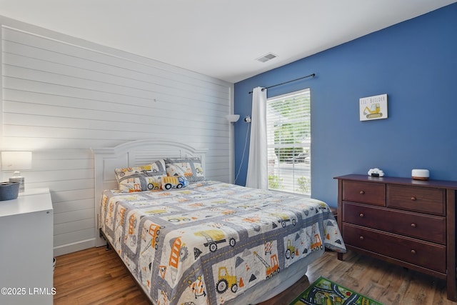 29 Wiregrass Way, Bluffton, SC 29910 - bedroom featuring wood finished floors and wooden walls
