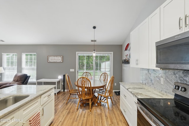 29 Wiregrass Way, Bluffton, SC 29910 - kitchen with stainless steel appliances, light wood-type flooring, and healthy amount of natural light