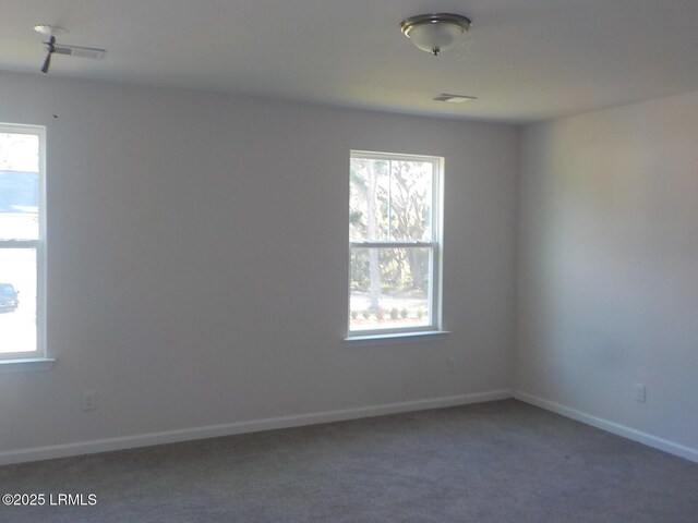 127 Teal Bluff Blvd, Seabrook, SC 29940 - unfurnished room with plenty of natural light and carpet flooring