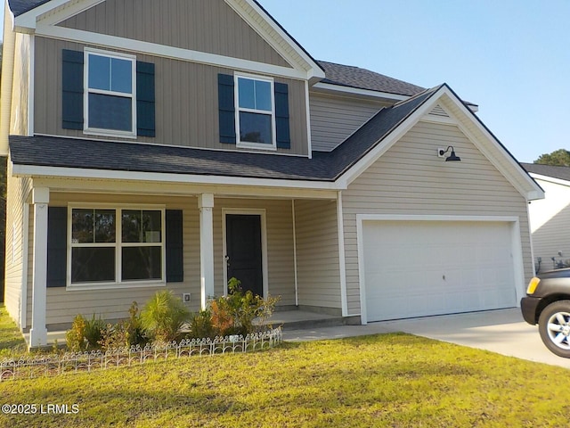 127 Teal Bluff Blvd, Seabrook, SC 29940 - view of front of home with covered porch, a garage, a front lawn, roof with shingles, and concrete driveway