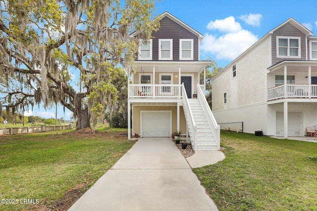 101 Palmetto Breeze Cir, Beaufort, SC 29907 - raised beach house featuring stairway, a garage, driveway, and a front yard