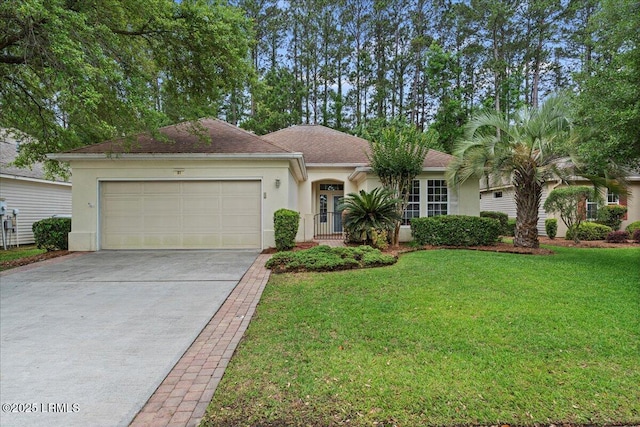 61 Hampton Cir, Bluffton, SC 29909 - single story home with stucco siding, an attached garage, driveway, and a front lawn