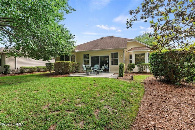 61 Hampton Cir, Bluffton, SC 29909 - back of property featuring a patio area, a yard, and roof with shingles