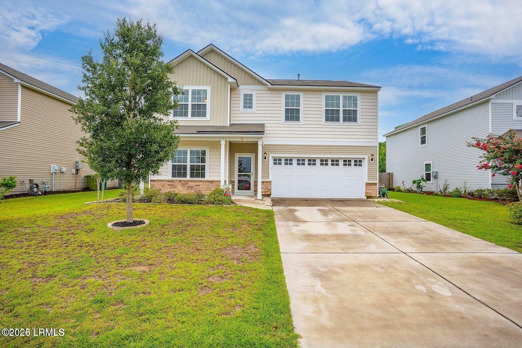 13 Combahee Way, Beaufort, SC 29906 - view of front of property with an attached garage, board and batten siding, concrete driveway, and a front yard