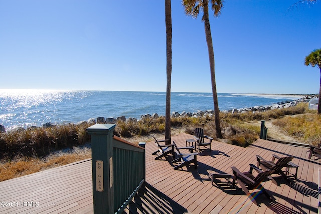 wooden terrace featuring a water view