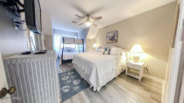 bedroom featuring ceiling fan and wood-type flooring