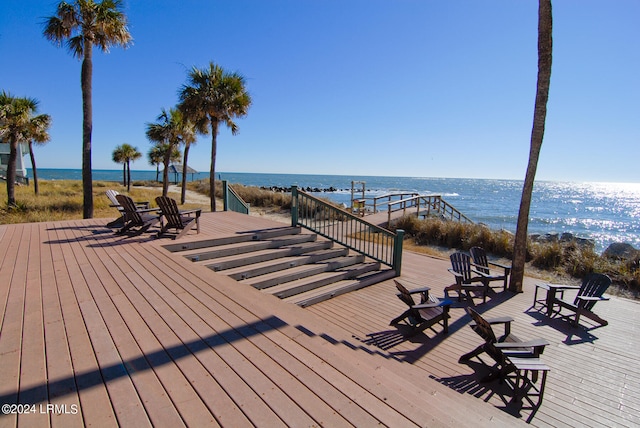 wooden deck featuring a water view