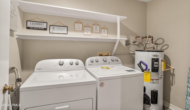 laundry area with independent washer and dryer and electric water heater