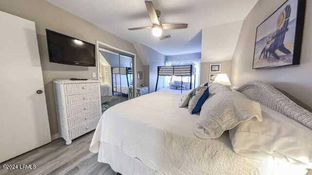 bedroom featuring hardwood / wood-style flooring and ceiling fan