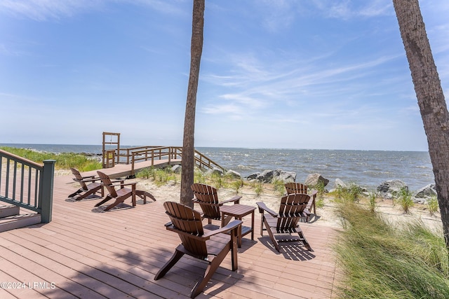 wooden deck with a water view