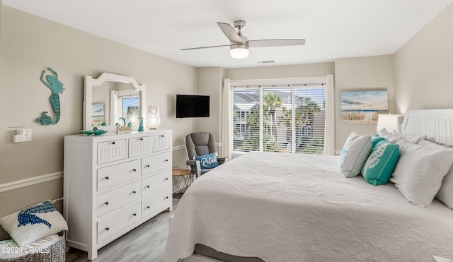 bedroom with light hardwood / wood-style flooring and ceiling fan