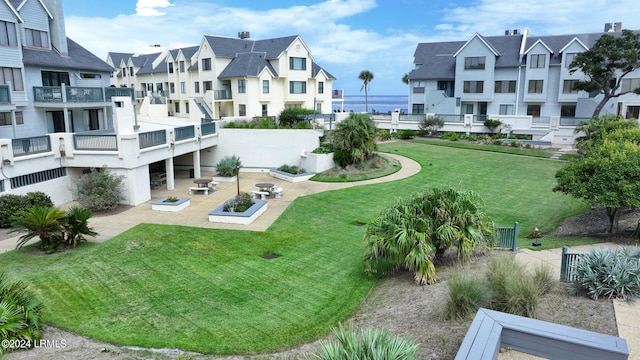 view of property's community with a yard