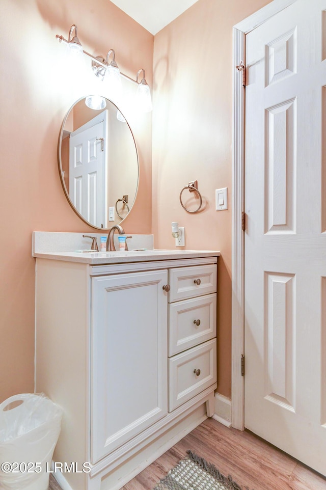 bathroom with vanity and hardwood / wood-style floors