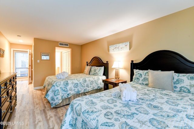 bedroom with light wood-type flooring