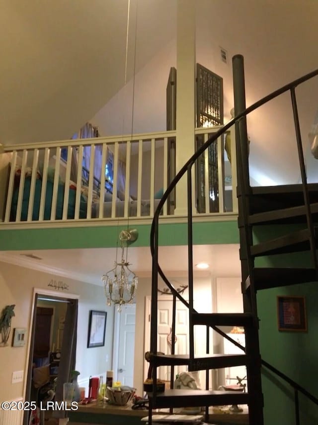 802 12th St, Port Royal, SC 29935 - stairs featuring a high ceiling and a chandelier