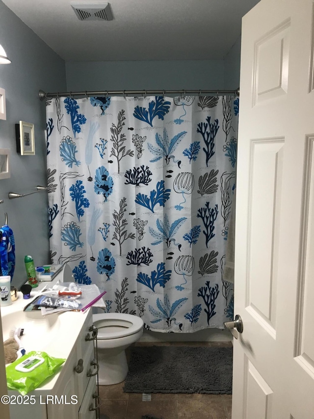 802 12th St, Port Royal, SC 29935 - bathroom with vanity, tile patterned floors, toilet, and a shower with curtain