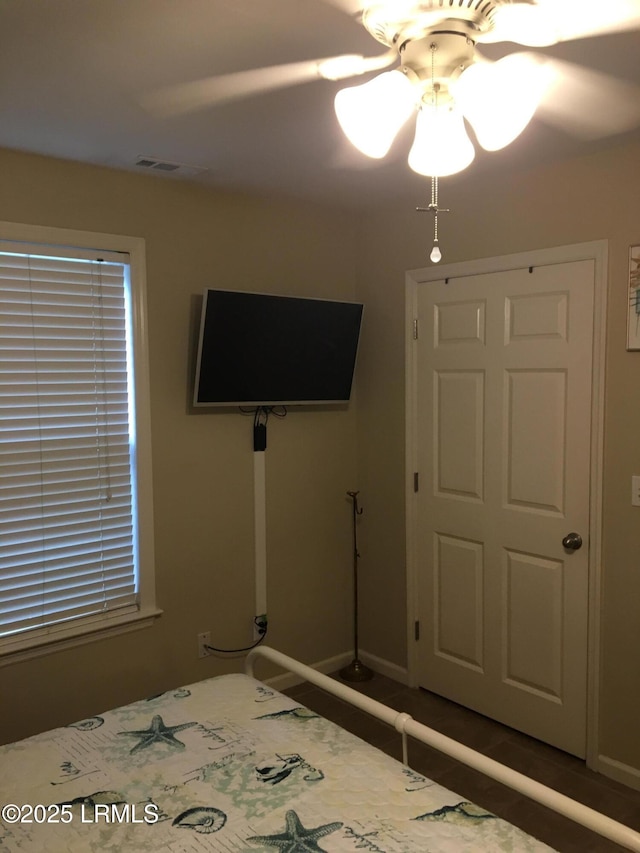 802 12th St, Port Royal, SC 29935 - unfurnished bedroom featuring a ceiling fan and baseboards