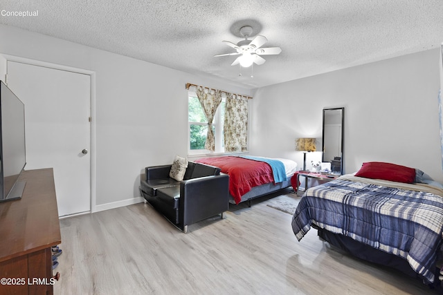 400 William Hilton Pkwy Unit 110, Hilton Head Island, SC 29926 - bedroom featuring wood finished floors, a textured ceiling, and ceiling fan