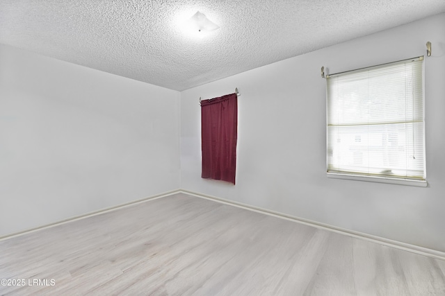 400 William Hilton Pkwy Unit 110, Hilton Head Island, SC 29926 - unfurnished room featuring wood finished floors and a textured ceiling