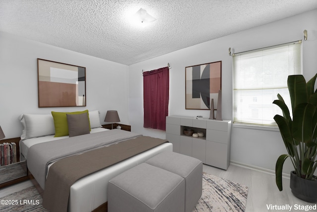 400 William Hilton Pkwy Unit 110, Hilton Head Island, SC 29926 - bedroom with a textured ceiling and wood finished floors