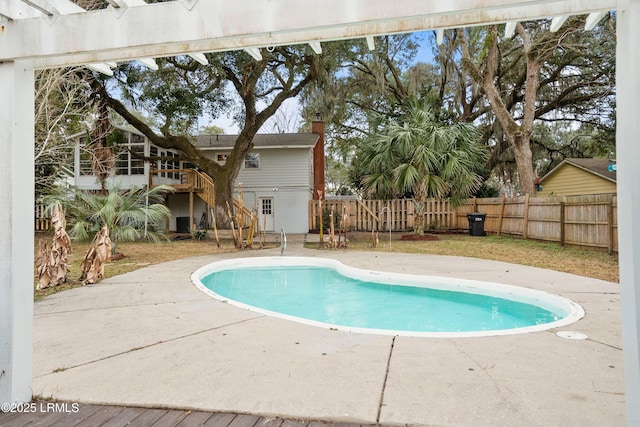 view of swimming pool with a patio