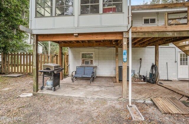 rear view of house featuring a deck