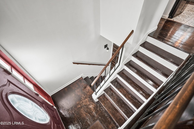 stairs featuring hardwood / wood-style flooring