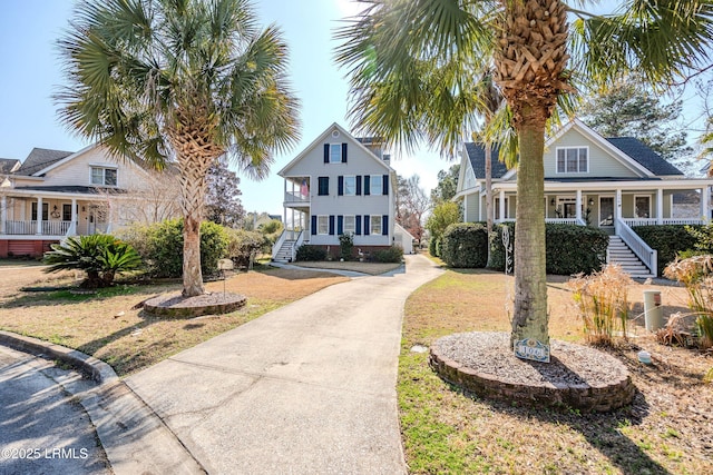 view of front of house featuring a front yard and covered porch