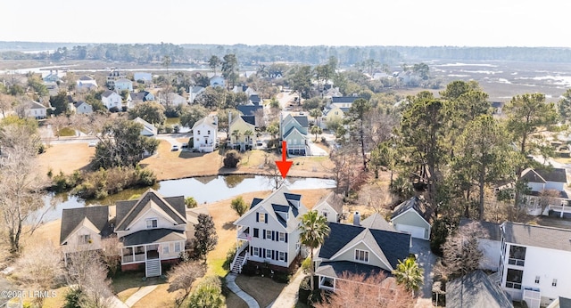 birds eye view of property featuring a water view