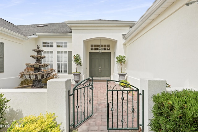 102 Lake Somerset Cir, Bluffton, SC 29909 - view of exterior entry featuring a gate and stucco siding