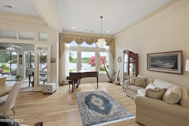 102 Lake Somerset Cir, Bluffton, SC 29909 - living room featuring plenty of natural light, a ceiling fan, a chandelier, light wood-style floors, and recessed lighting