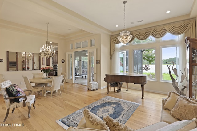 102 Lake Somerset Cir, Bluffton, SC 29909 - living area featuring a chandelier, light wood-type flooring, a high ceiling, and recessed lighting