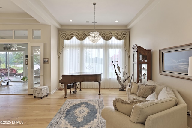 102 Lake Somerset Cir, Bluffton, SC 29909 - living room featuring a chandelier, light wood finished floors, and ceiling fan