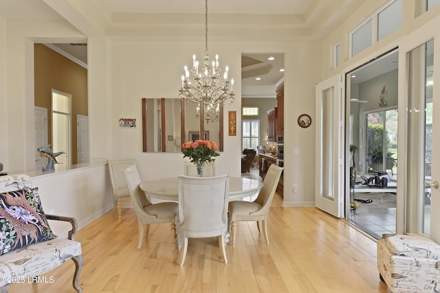 102 Lake Somerset Cir, Bluffton, SC 29909 - dining area with light wood-style flooring, a chandelier, and ornamental molding