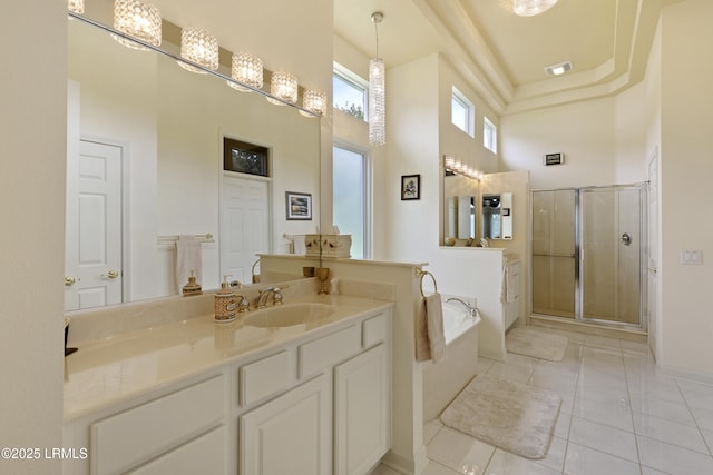 102 Lake Somerset Cir, Bluffton, SC 29909 - full bath with a towering ceiling, a stall shower, a bath, vanity, and tile patterned flooring