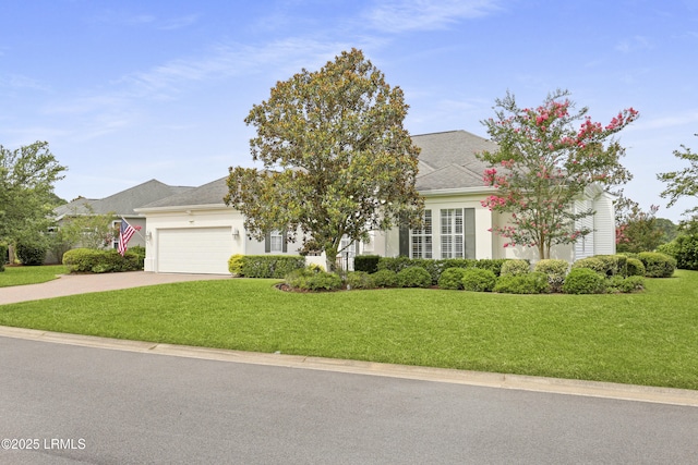 102 Lake Somerset Cir, Bluffton, SC 29909 - obstructed view of property with a garage, concrete driveway, a front yard, and stucco siding