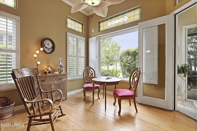 102 Lake Somerset Cir, Bluffton, SC 29909 - dining space with light wood-style floors, a ceiling fan, ornamental molding, and a towering ceiling