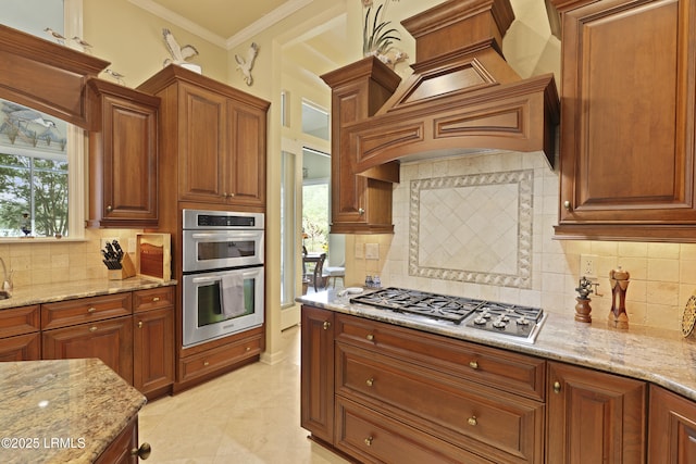 102 Lake Somerset Cir, Bluffton, SC 29909 - kitchen featuring appliances with stainless steel finishes, custom exhaust hood, light stone countertops, backsplash, and ornamental molding