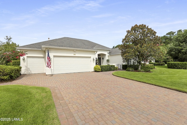 102 Lake Somerset Cir, Bluffton, SC 29909 - view of front of house with decorative driveway, an attached garage, stucco siding, and a front yard
