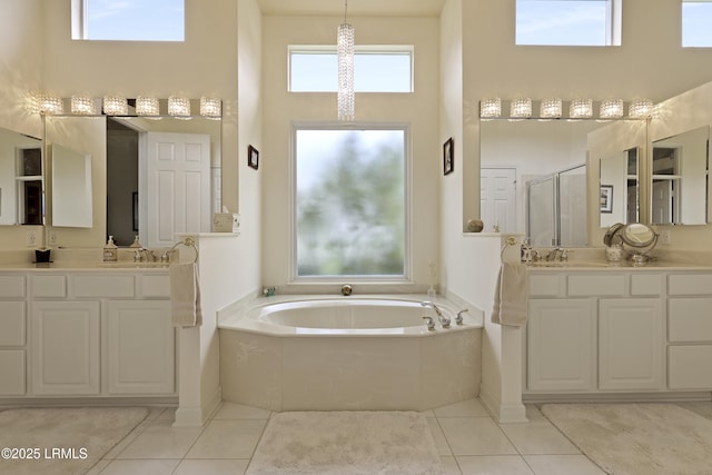102 Lake Somerset Cir, Bluffton, SC 29909 - bathroom featuring a high ceiling, a bath, two vanities, a shower stall, and tile patterned flooring