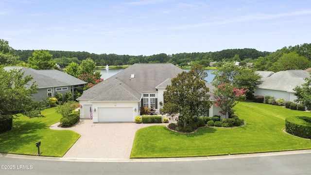 102 Lake Somerset Cir, Bluffton, SC 29909 - view of front of house with an attached garage, a front lawn, driveway, and a water view