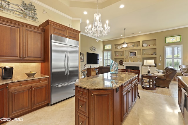102 Lake Somerset Cir, Bluffton, SC 29909 - kitchen featuring built in fridge, ornamental molding, open floor plan, a fireplace, and a ceiling fan