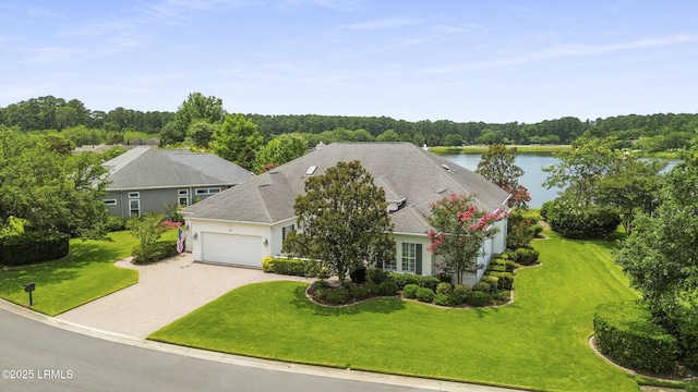 102 Lake Somerset Cir, Bluffton, SC 29909 - view of front of home featuring a garage, decorative driveway, a water view, and a front lawn