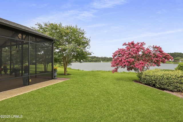 102 Lake Somerset Cir, Bluffton, SC 29909 - view of green lawn with a water view and a sunroom