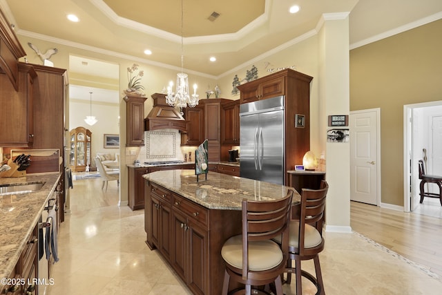 102 Lake Somerset Cir, Bluffton, SC 29909 - kitchen featuring stainless steel appliances, custom exhaust hood, a chandelier, a center island, and a kitchen breakfast bar