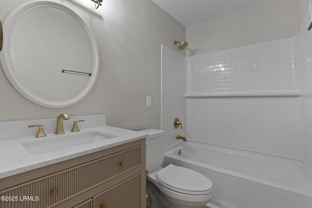 bathroom with vanity, shower / bathing tub combination, and toilet