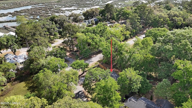 birds eye view of property with a forest view