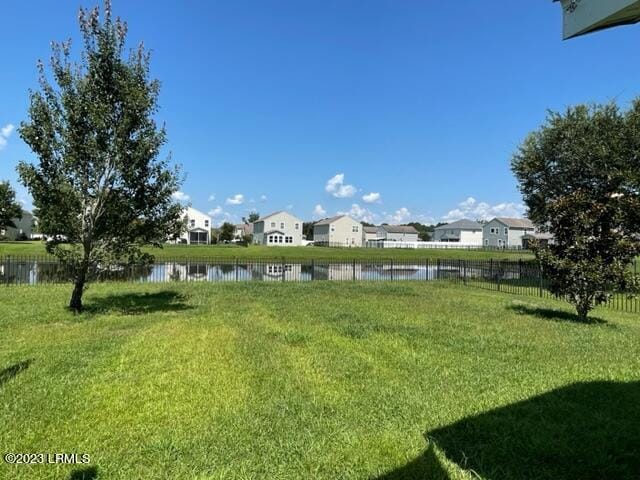 46 Pennyroyal Way, Beaufort, SC 29906 - view of yard featuring a residential view, fence, and a water view