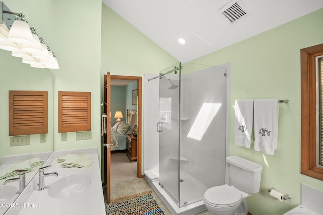 full bathroom featuring visible vents, a shower stall, vanity, toilet, and lofted ceiling